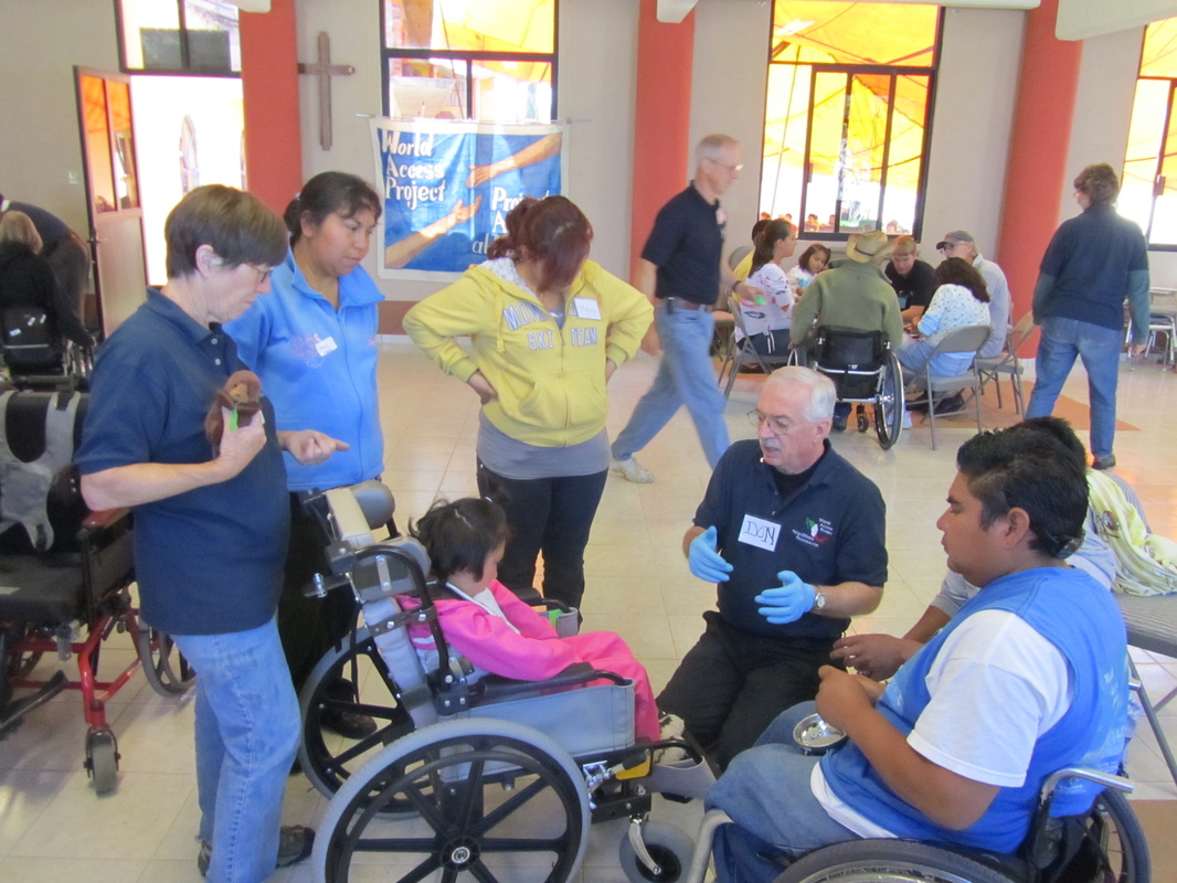 Our U.S. team of volunteers fine tuning a child's wheel chair